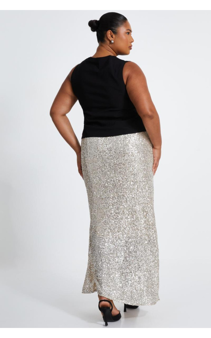 Від білої кривої блискітки максі спідниця