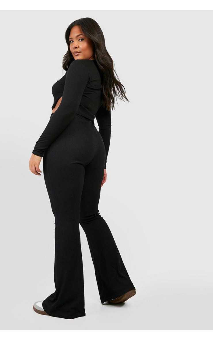 Плюс базові кльошові штани з високою талією в рубчик