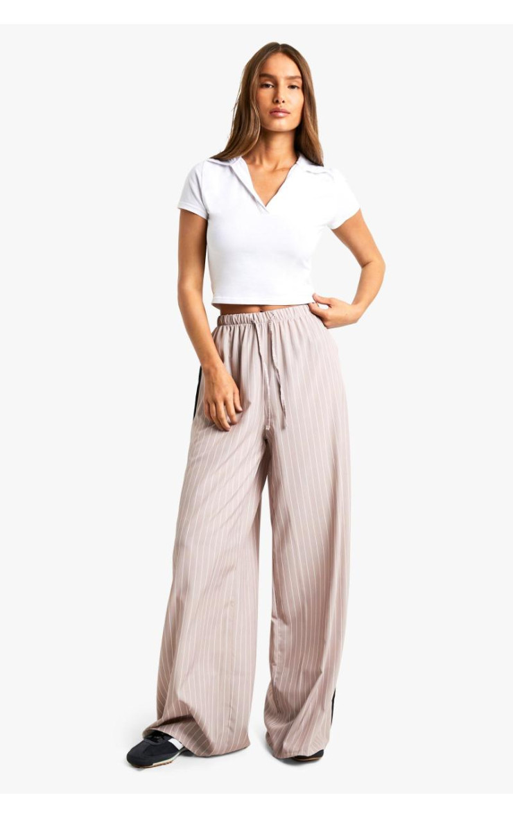 Широкі брюки зі шнурками в тонку смужку збоку