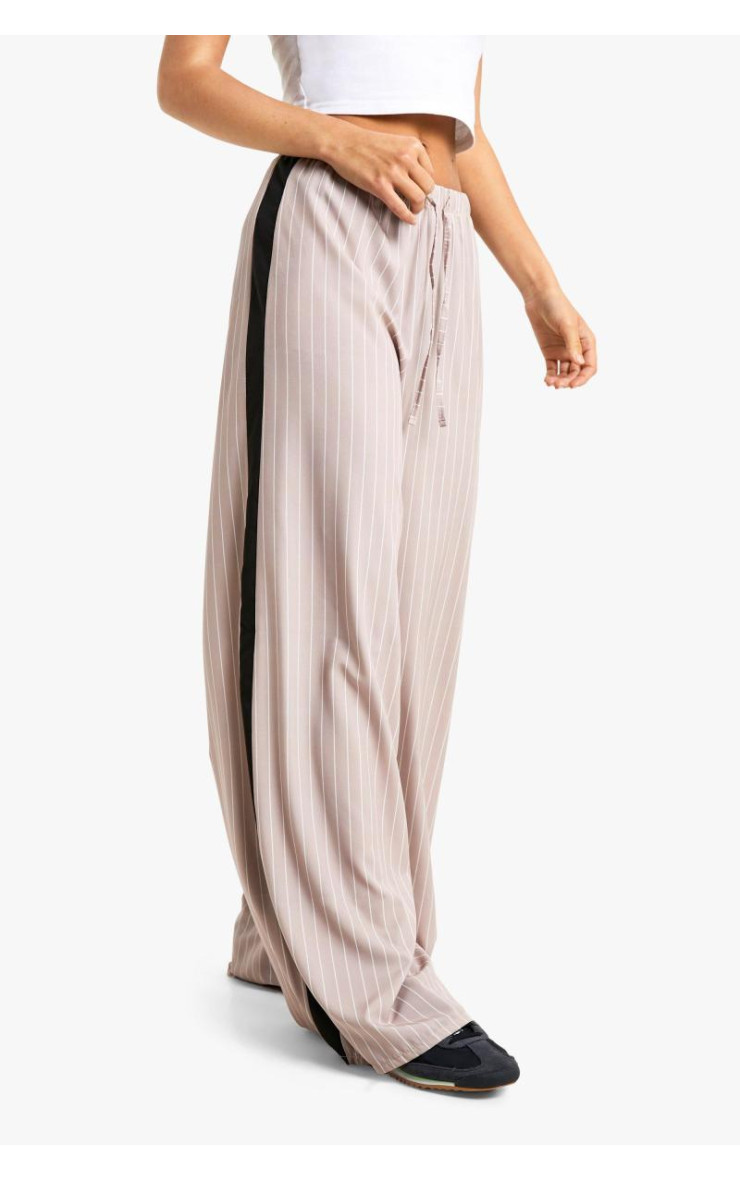 Широкі брюки зі шнурками в тонку смужку збоку