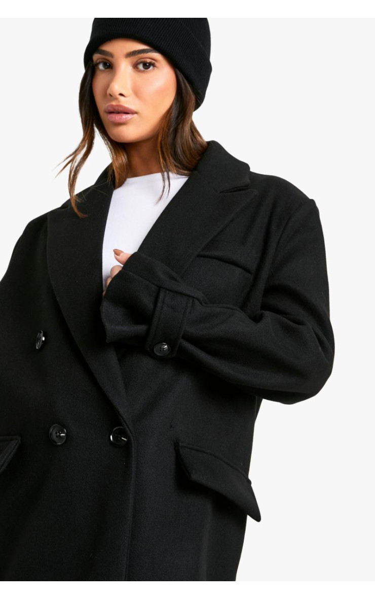 Маленьке пальто вовняного вигляду з великими манжетами