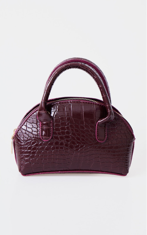 Вигнута сумка через плече бордового кольору з крокодилом