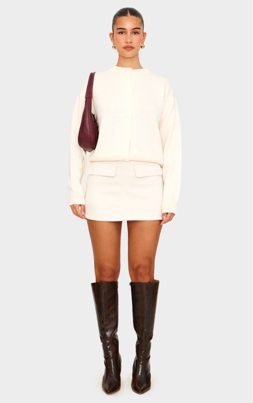 Міні-спідниця з кишеньками з кишені і штучної замші кольору екрю Міні-спідниця з кишеньками з кишені і штучної замші кольору екрю