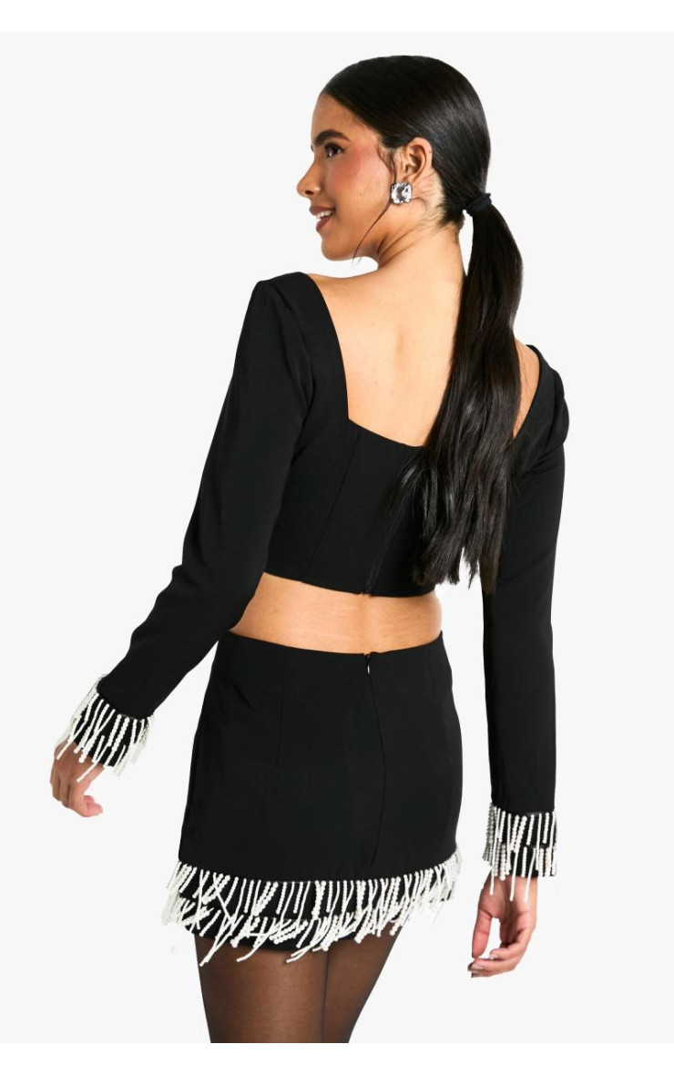 Міні-спідниця з перлинним оздобленням